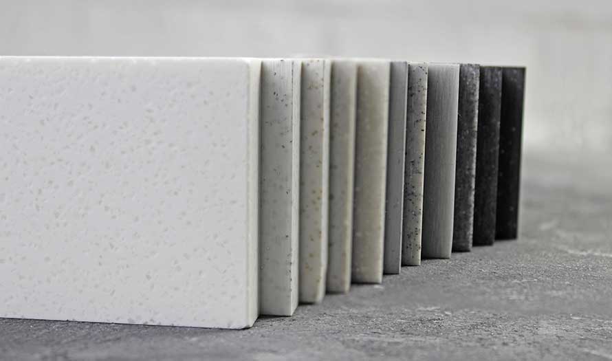 A close-up of a cluster of Luxury marble and natural stone slabs for kitchen worktops.