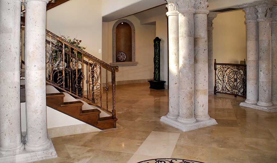 Full view of the residence's stunning entrance, which has travertine floors and stone canterra columns.